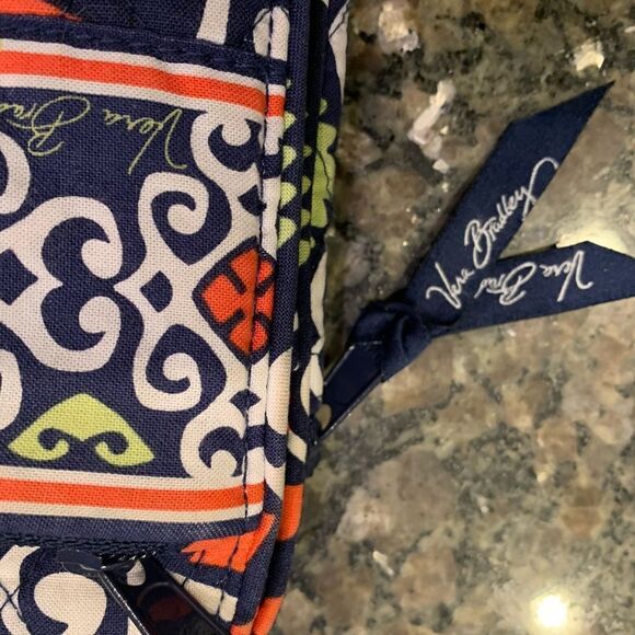 Vera Bradley crossbody bag.  Lots of organization in a compact bag. ID window - Picture 2 of 6